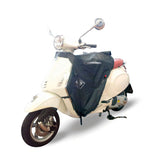 Coprigambe Termoscud R170X, un coprigambe nero con trattamento idrorepellente. In uso su scooter. Di Tucano Urbano.